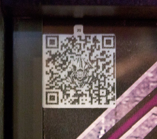 The QR code in the top left of the translite
