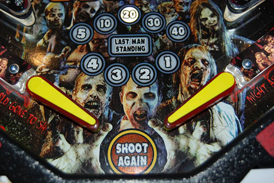 The flippers and the walker kill counter just above them, as our zombie friends try to cheer things up