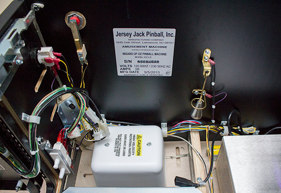 The shaker motor, details sticker, plumb bob and USB extension cable