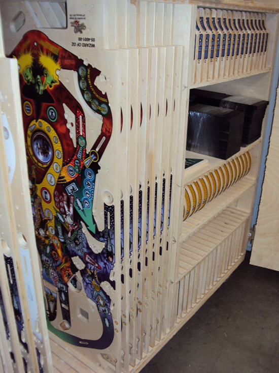 A rack of playfields, mini-playfields, apron toppers and other wooden parts...