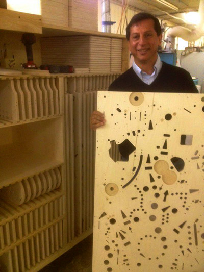 Jack with another playfield as it comes out of the CNC machine