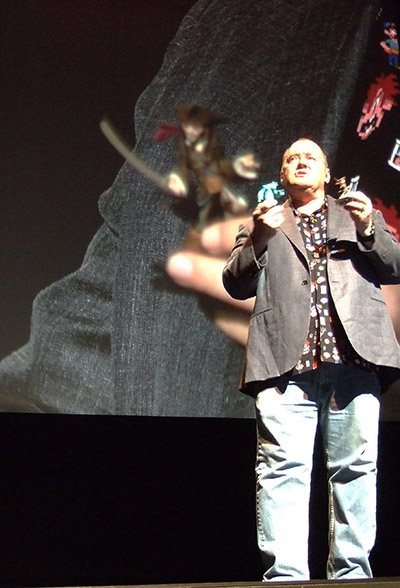 John Lasseter demonstrates the physical toys available for Disney Infinity