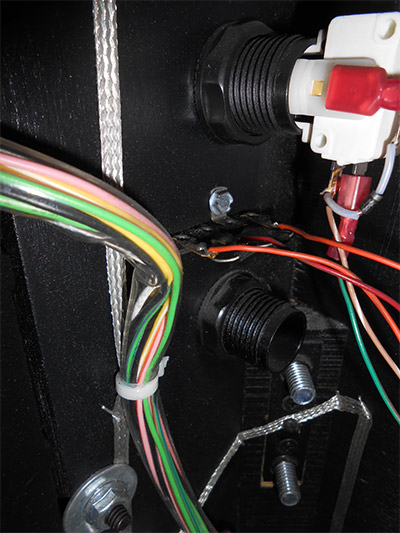 The blanking plug beneath the main start button