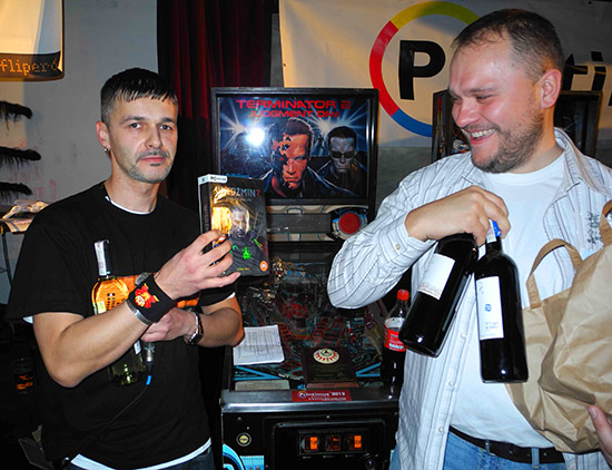 Mario with his wine and copy of Witcher2, with the author of this report