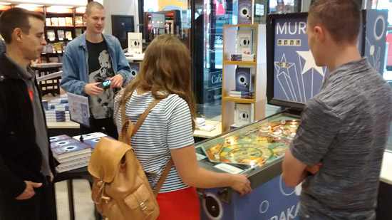 Chris Poyntz (left) and Lukasz Romanowski (right) from the UK Pinball League join Will and Rosie from Penguin Random House