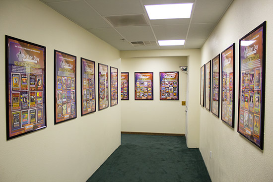The corridor is lined with framed trading cards