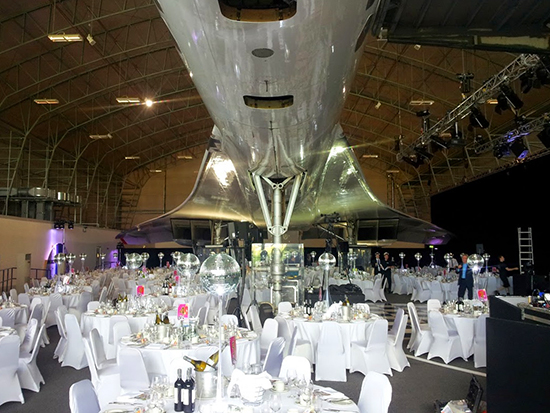 The guest's tables were set-up under the plane's fuselarge and wings