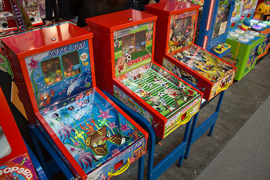 Back in the amusements hall, the ever-popular mini-pinball dispensors were available from several vendors