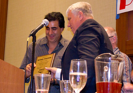 Michael Shalhoub receives his plaque from Mike Pacak