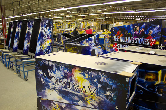 Cabinets for Avatar, The Rolling Stones and Tron are stacked in the factory