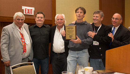 John is congratulated by Mike Pacak, Steve Ritchie, Gary Stern, Joe Kaminkow and Rob Berk