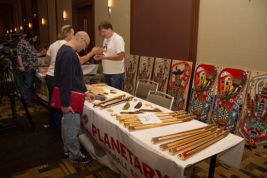 Planetary Pinball Supply had a stand selling gold plated legs and bolts, as well as a wide selection of translites and many other parts