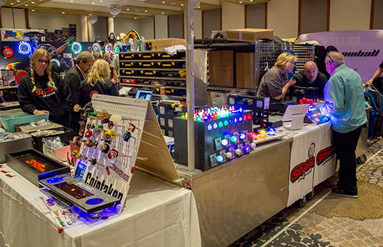 Custom shooter rods, flipper buttons and Stern merchandise on the CoinTaker stand