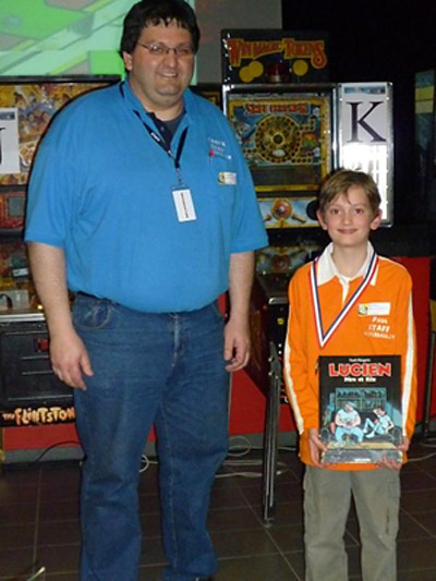 Paul Baffault second-placed young French player, here with his prize a comics from Frank Margerin