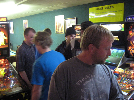 Players getting the names of their competitors and games in the May Day 2012 Double Elimination Pinball Tournament