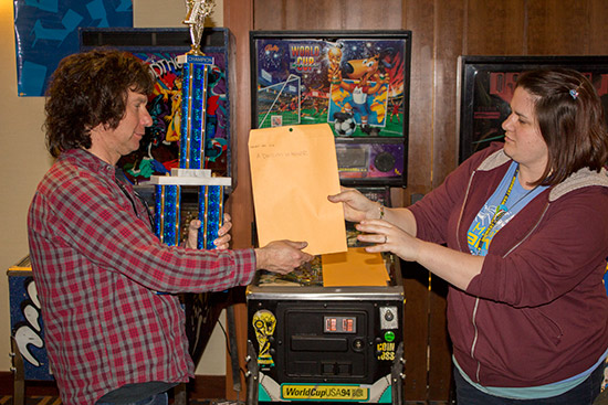 Dave receives his winner's trophy, certificate and cash prize 