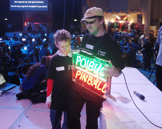 Chris (Poibug) supported by his son on stage Saturday afternoon