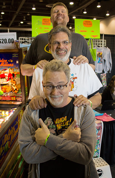 Todd celebrates his win with the game's creators Dennis Nordman and Greg Freres