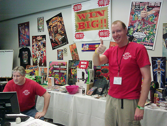 Byron Raynz and Tom man the Raffle booth, full of great prizes