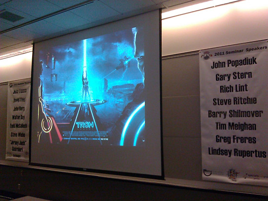 The TRON backglass is offered as a seminar backdrop