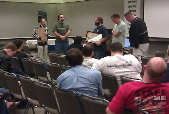 Walter Day holds his seminar where he awards video game and pinball world record plaques to various individuals