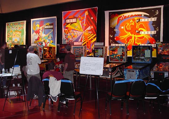 Ed Cassel's canvases form the backdrop to the tournament machines