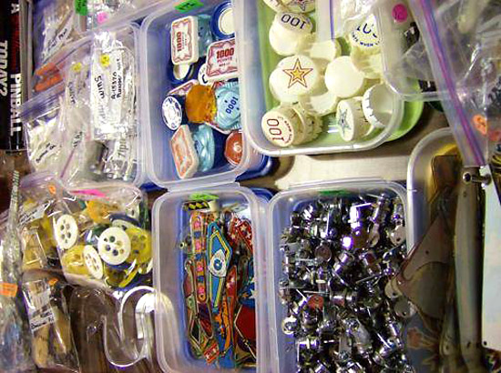 …and parts.  Table after table of plastics, backglasses, manuals, memorabilia, pinball protectors and odd bits you didn’t even know existed.  But now that you do, can you live without them?