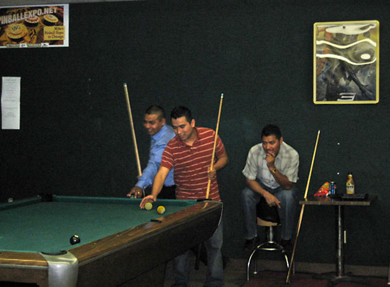 Another group of friends; enjoying a round of billiards