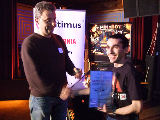 Winner of the Polish Pinball Championships 2010, Krisztián Szalai with his Pin•Bot prize, his trophy and his certificate