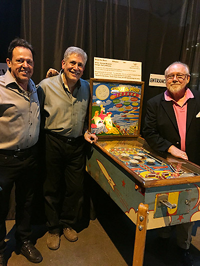 Michael Schiess, PPM Founder, Larry Zartarian, PPM Board President and Gordo admire the show’s signature game