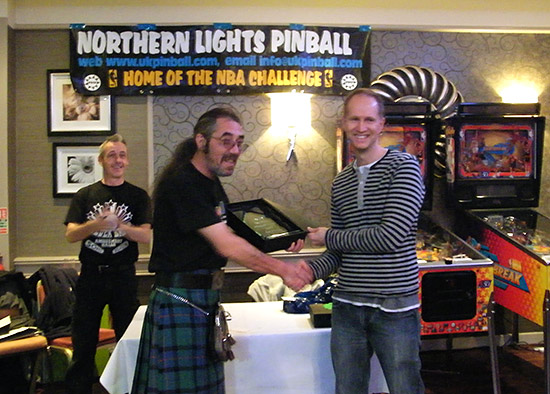 Scottish Open 2012 winner, Greg Mott is presented with his trophy