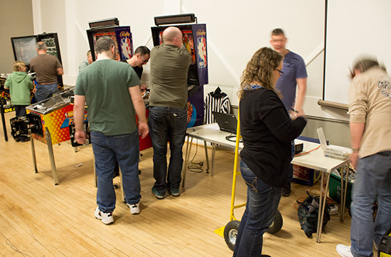 The Northern Lights Pinball team sets up their competition area