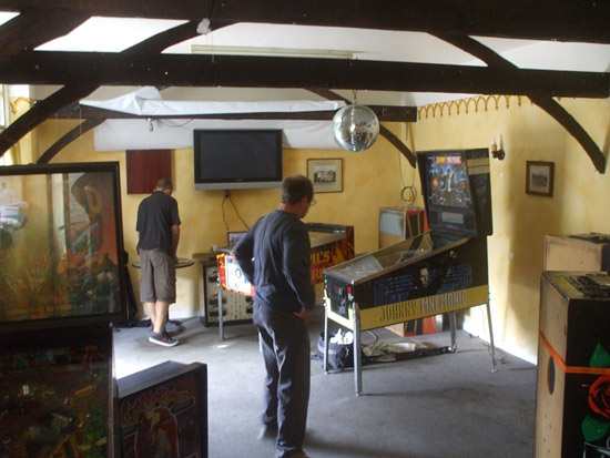 Andy Netherwood of Pinball Mania and Stan Simpson get the machines set up