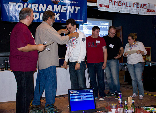 The Pinball Predators are presented with their medals and certificates