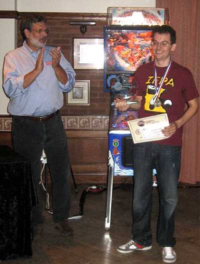 Brenn receives his prizes from Dennis