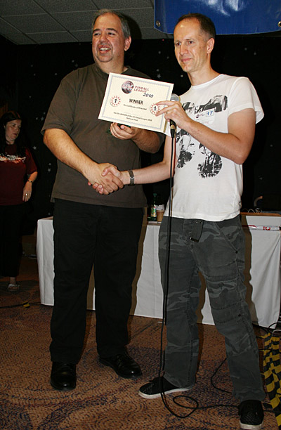 Martin Ayub receives his trophy from UK Pinball League Coordinator, Greg Mott