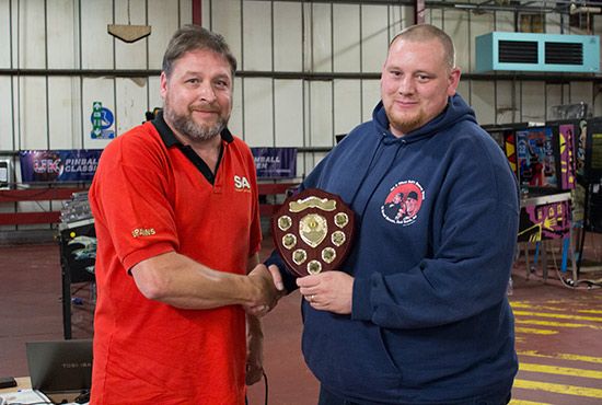 Welsh Pinball Cup winner Matt Vince receives the Dave Rolfe Memorial Shield