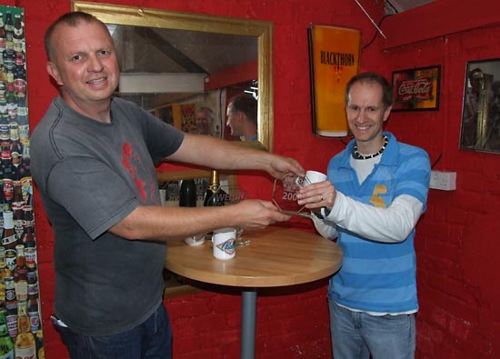 Greg Mott collects his trophy and mug for third place
