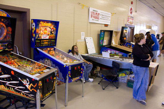 One the side wall, Let's Play Pinball had their cabinets and two demonstrator games