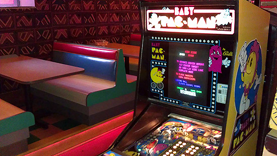A Baby Pac-Man with the diner-style seating