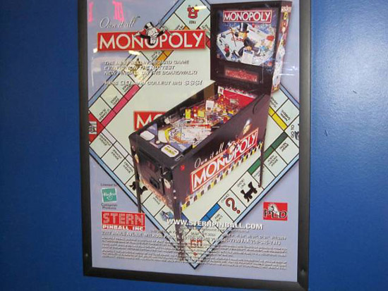 A framed Monopoly flyer
