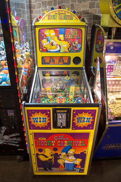It's hard to roll a swipe card down the playfield, so this Stern-built Simpsons Kooky Carnival is also token play only